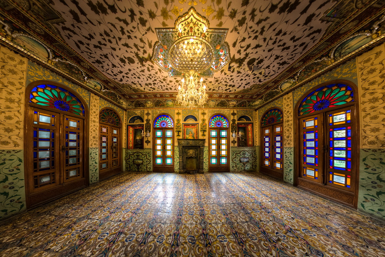 Emarat-e-Badgir (Windward Edifice) is one of the buildings in the Golestan Palace complex in Tehran, which dates back to Qajar era. This edifice has been the location for coronation of Mozaffar-e-Din Shah of Qajar. The building retains a windward on the top which clarifies the title. The exclusive ornaments of this building such as the glasses, the mirrors, and tall columns are of exceptional beauty. As soon as I entered the building of wind catchers,the first and the most important thing that got my attention,was  glourious mirror works on the ceiling. Generally,when you think of a mirror,you see it as a tool which you can see yourself in it,that's why you find a mirror interesting and amusing. But when it combines with art,when it is divided into little pieces and placed next to each other artistically,it makes you to pay attention to the space and not yourself anymore. It's like the ceiling is a carpet made of mirrors which is seen all over the place.That is why it is so fantastic. This picture is showing a room inside this building.