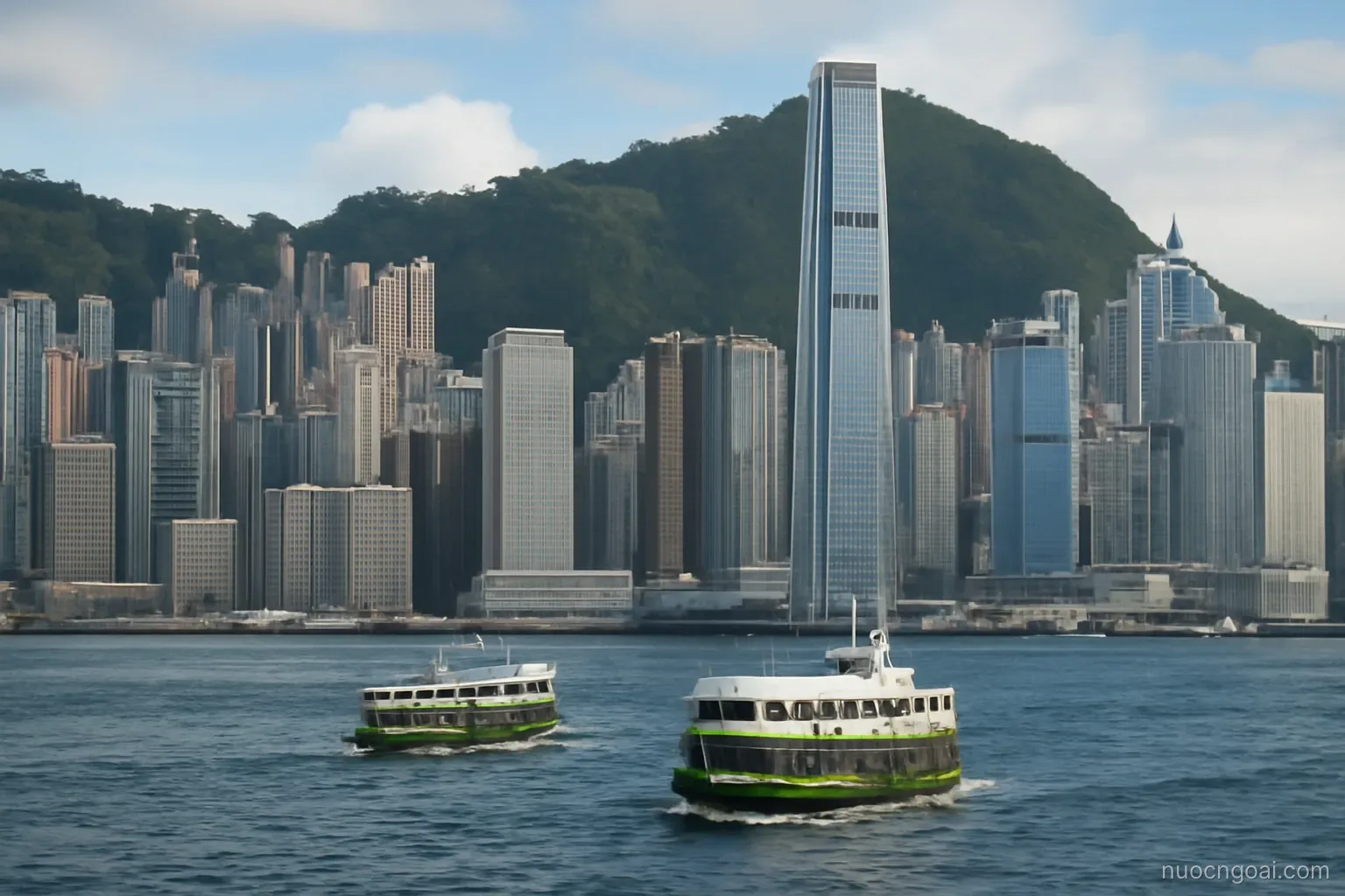 Steep green hills rising directly behind a dense harbour skyline with ferries crossing the water
