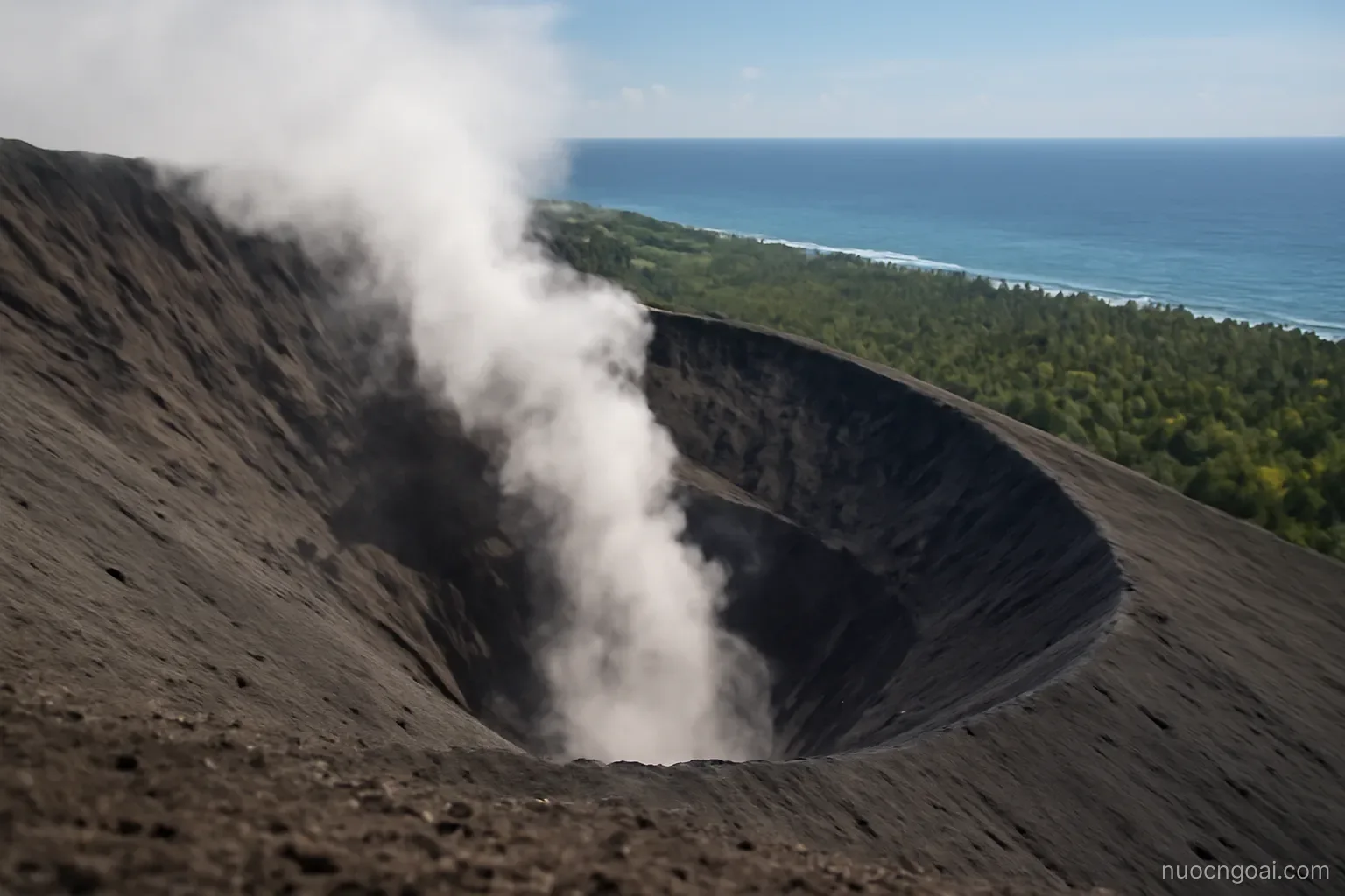 A steaming volcanic crater rim with ash slopes falling away toward coconut groves and open ocean